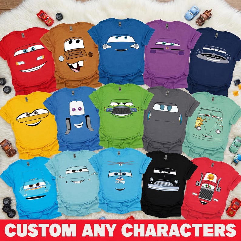 May include: A selection of brightly coloured t-shirts with cartoon car designs. The shirts are in various colours, including red, blue, yellow, and green. The text "CUSTOM ANY CHARACTERS" is displayed at the bottom of the image.
