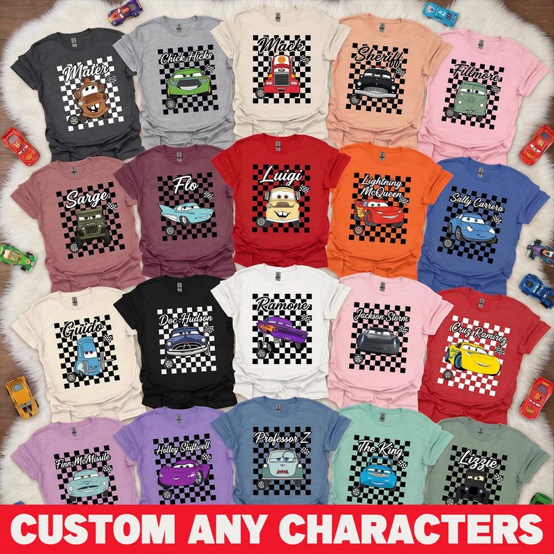 May include: A collection of colorful t-shirts featuring various characters from the movie Cars. Each shirt displays a character's image on a checkered background. The text "CUSTOM ANY CHARACTERS" is at the bottom.