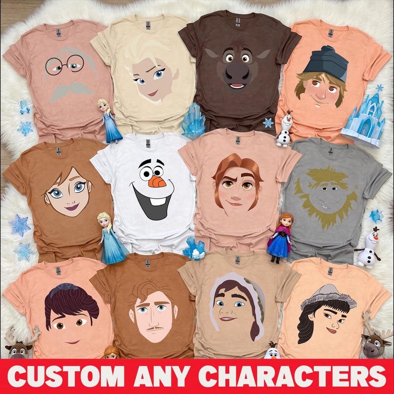 May include: Assorted t-shirts featuring cartoon character faces in various colors. The shirts are displayed on a white fluffy surface. The text "CUSTOM ANY CHARACTERS" is at the bottom of the image.