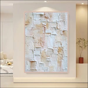 May include: A rectangular wall art piece featuring a thick, textured impasto application of white and light beige paint. The surface displays a layered, blocky pattern created with visible brushstrokes and palette knife marks, forming a relief.