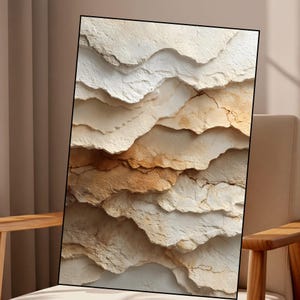 May include: Abstract art print with a layered, textured design in white, beige, and brown tones. The artwork has a natural, earthy aesthetic, with a focus on the interplay of light and shadow across the textured surfaces.