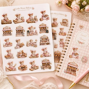 May include: Two sheets of watercolor clipart featuring a "Little Mouse Bakery" theme. The sheets display various illustrations of mice baking and selling pastries. A pink and white checkered notebook with the words "Sweet Things" is also visible, along with a pink pen.