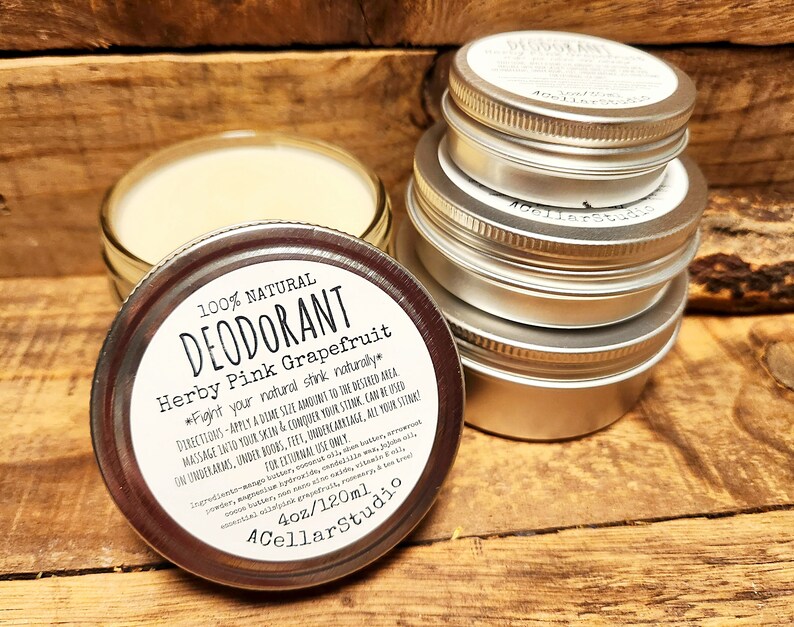 May include: A silver tin of natural deodorant with a white label that reads "100% Natural Deodorant Herby Pink Grapefruit *Fight your natural stink naturally* Directions: Apply a dime size amount to the desired area. Massage into your skin & conquer your stink. Can be used on underarms, under boobs, feet, undercarriage, all your stink? For external use only. Ingredients: mango butter, coconut oil, beeswax, arrowroot powder, shea butter, kaolin clay, vitamin E oil, essential oils, witch hazel, rosemary & tea tree oil. 4oz/120ml 4CellarStudio"