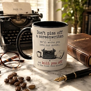 May include: A white ceramic mug with a black handle and rim, featuring the text: Don't piss off a screenwriter. We'll write you into our movie... and kill you off in the first five minutes. The design includes a small illustration of a typewriter.
