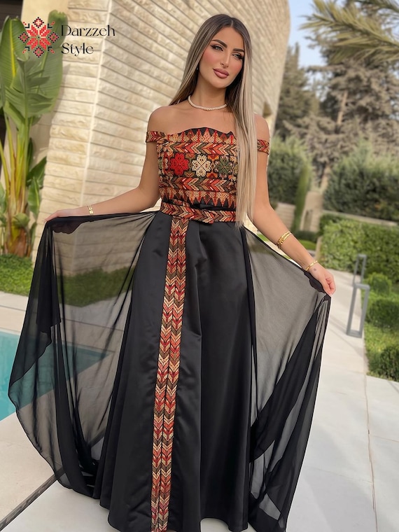 dishdasha dress Traditional Mens Saudi Style Thobe Classic Black crepe base Traditional Palestinian machine embroidery Loose fit Inner lining Separate embroidered belt with clips Piece is 150 cm from shoulder to end The model height is 167 cm and weighs 49 kg in 6 cm heels and is wearing size S Garment measurements in cm (this is a loose fit) Size Length Bust Width Shoulder Sleeve S 150 48 36 64 M 150 50 38 64 L 150 52 40 64 XL 150 54 42 64 2XL 150 56 44 64 Palestinian Tatreez Embroidered Off-Shoulder Maxi