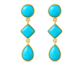 May include: A pair of gold-toned drop earrings featuring turquoise-colored stones. Each earring has a round top, a diamond-shaped center, and a teardrop-shaped bottom. The stones are set in gold-colored frames.