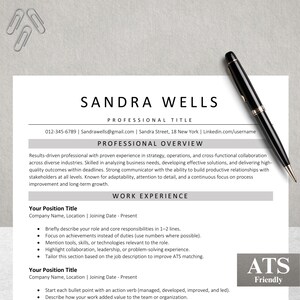 May include: A resume template with the name "Sandra Wells" at the top. The resume includes sections for professional overview and work experience. A black and silver pen rests on the right side of the resume. Paper clips are in the upper left corner.