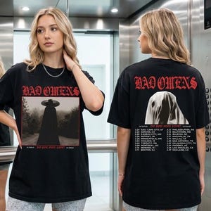Maglietta grafica del tour "Do You Feel Love?" dei Bad Omens, abbigliamento da concerto.