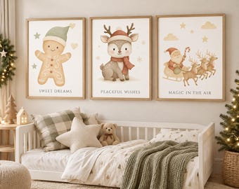 May include: Three framed wall art prints featuring watercolor illustrations of a gingerbread person, a reindeer, and Santa in a sleigh. The prints include the text SWEET DREAMS, PEACEFUL WISHES, and MAGIC IN THE AIR in a neutral color palette.