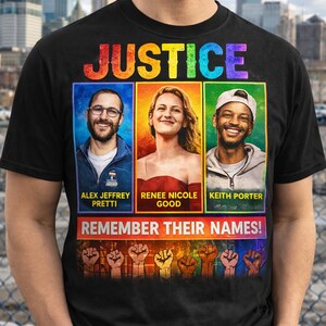 May include: Black t-shirt with the word "JUSTICE" in rainbow colours. The shirt features three portraits with names below: Alex Jeffrey Pretti, Renee Nicole Good, and Keith Porter. The phrase "REMEMBER THEIR NAMES!" is printed below the portraits.