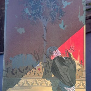 May include: An illustration featuring a person in a dark green cloak, with a light-colored head, facing a boar. The background includes a tree with a snake, birds, and a red and gold decorative border.