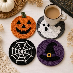 May include: A set of four round crochet coasters featuring Halloween designs: an orange jack-o'-lantern, a white ghost on a dark gray background, a white spiderweb on a black background, and a black witch hat with a yellow buckle on purple.