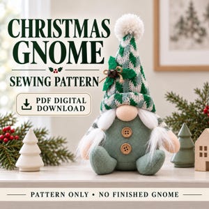 May include: A Christmas gnome sewing pattern PDF digital download featuring a gnome with a green and white chevron hat, a white pom-pom, two wooden buttons on a sage green body, and white yarn braids. Text reads: CHRISTMAS GNOME SEWING PATTERN.