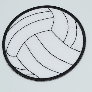 May include: White volleyball with black stitching, a round patch with a black border.