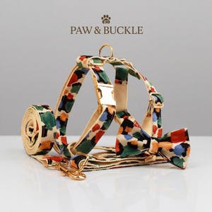 May include: A set of three ceramic mugs with a speckled, matte finish. The mugs are in shades of cream, light gray, and dark gray. Each mug has a simple, minimalist design, perfect for coffee or tea.