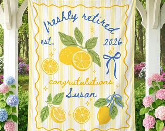 May include: A rectangular fabric banner featuring a yellow and white vertical striped background with a wavy yellow border. The design includes illustrations of lemons with green leaves, blue ribbons, and the text freshly retired est. 2026 congratulations Susan.