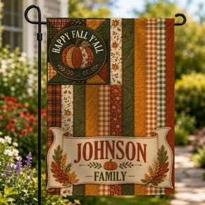 May include: A rectangular garden flag featuring vertical stripes in autumn colors of orange, green, and brown with plaid and leaf patterns. A circular patch displays a pumpkin and the text HAPPY FALL Y'ALL. A banner at the bottom reads JOHNSON FAMILY.