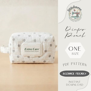 May include: A white diaper pouch with a gray polka dot pattern, featuring a white lid labeled "Extra Care Premium Baby Wipes." The pouch has a handle and is on a wooden surface. Text on the right side reads "Diaper Pouch" and "ONE SIZE."