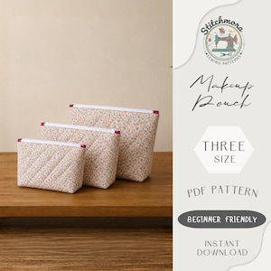 May include: Three quilted makeup pouches in varying sizes, arranged on a wooden surface. The pouches feature a floral pattern on a cream background, with white trim and red accents. The image also includes text that says "Makeup Pouch" and "Three Size".