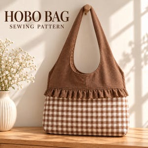 May include: A hobo bag sewing pattern featuring a brown solid fabric upper section and a brown and white gingham checked lower section, separated by a horizontal ruffled trim. The text HOBO BAG SEWING PATTERN is visible.