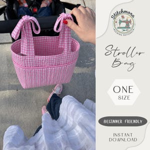 May include: A pink and white gingham stroller bag featuring two tie-top handles and a front pocket. The bag is quilted with a grid pattern. Text on the side includes Stitchmora Sewing Patterns, Stroller Bag, One Size, Beginner Friendly, and Instant Download.