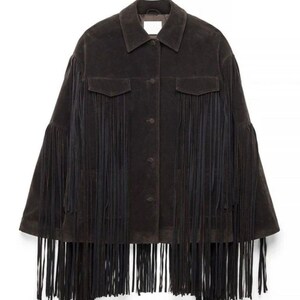 May include: A dark brown suede jacket featuring a classic collar, a button-down front, and long sleeves. The garment is adorned with extensive fringe detailing that extends from the chest across the sleeves and along the bottom hemline.