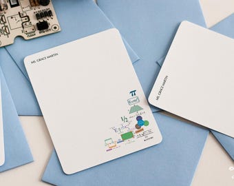 May include: Three blank white note cards with blue envelopes. The note cards have a handwritten name, "Ms. Grace Martin", and a small graphic of a mathematical equation with the number pi. The note cards are from La Petite Note.