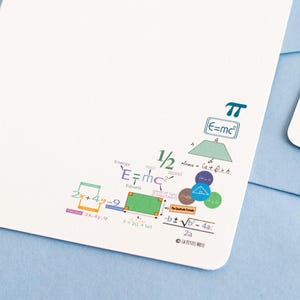 May include: A white card with a colorful illustration of various mathematical formulas and equations, including pi, E=mc², and the quadratic formula. The card is blank on the right side for writing a message. The text "La Petite Note" is printed in the bottom right corner.