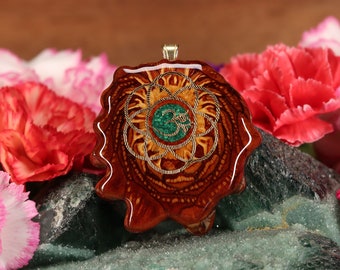 Pinecone Pendant with Crushed Malachite (Glows) and Gold Seed of Life with Front Om (Medium) by Third Eye Pinecones