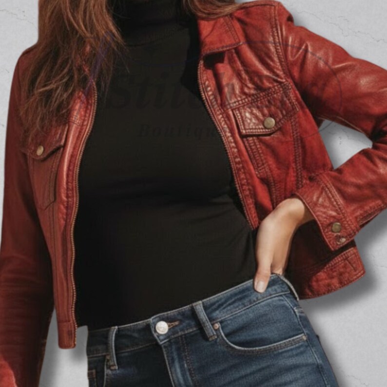 May include: A red leather jacket with a classic design, featuring two chest pockets and button closures. The jacket is paired with a black turtleneck and blue jeans. The image shows a stylish, casual outfit.