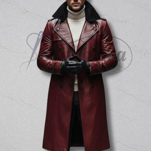 May include: A burgundy leather trench coat with a black collar and double-breasted button closure. The long coat features a tailored fit and is worn with black gloves and a cream-colored turtleneck. A stylish outerwear garment.