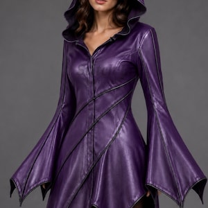 May include: A deep purple hooded jacket made of a smooth material, featuring long flared sleeves with pointed edges, a button-down front, and black piping details that create diagonal lines across the bodice and down the sleeves.