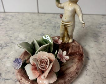 Vintage  Italian Capodimonte porcelain cherub with roses figurine.