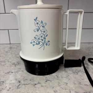Vintage white Regal Electric Poly Hot-Pot with a blue floral design.
