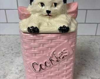 Vintage McCoy Pottery black and white cat in pink basket cookie jar.