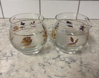 Juego de lechera y azucarero vintage de cristal Libbey con diseño de follaje dorado.