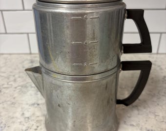Vintage Wear-Ever aluminum stovetop coffee percolator with bakelite handles.