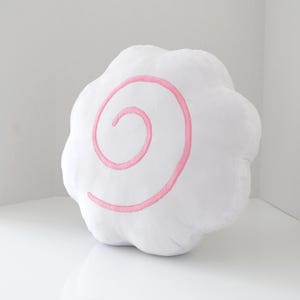 May include: A set of three ceramic vases in varying heights and shapes. The vases are glazed in a matte white finish, offering a minimalist aesthetic. The tallest vase is approximately 10 inches high.