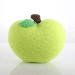 May include: A plush green apple with a brown stem and a green leaf.