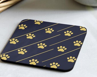 Dessous de verre, bandes bleu marine foncé avec empreintes de pattes dorées