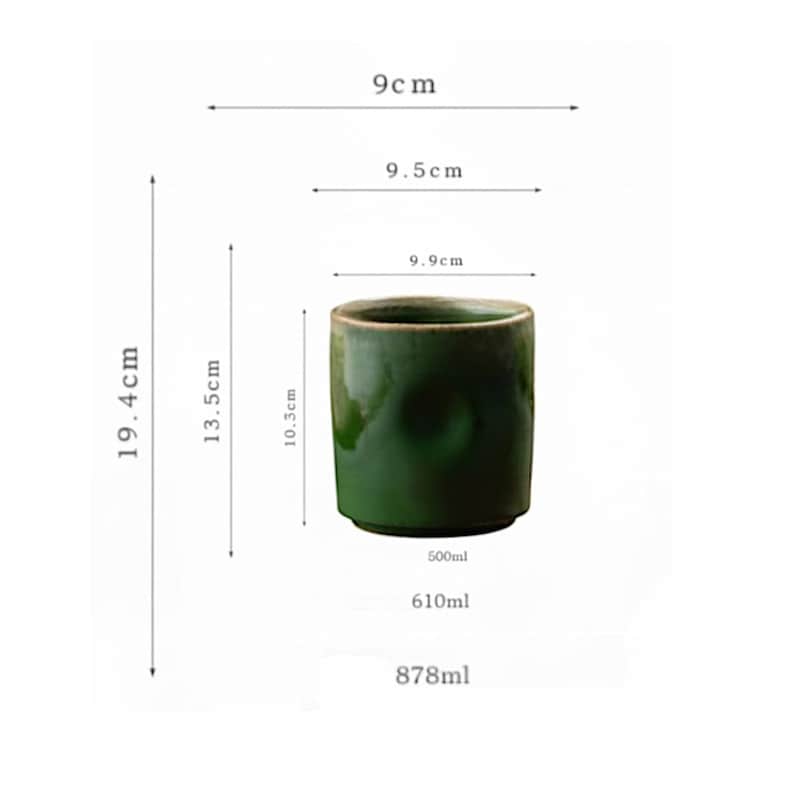 May include: A dark green ceramic cup with a glossy finish. The cup is cylindrical, 3.9 inches in diameter, and 7.6 inches tall. The image also shows the cup's capacity, which is 16.9, 20.6, and 29.7 fluid ounces.
