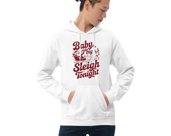 May include: White hooded sweatshirt with a front pocket and a burgundy graphic. The graphic features Santa Claus in a sleigh with the text "Baby ride my Sleigh Tonight". A festive apparel item for the holiday season.