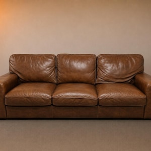 Brown Leather Sofa. Natuzzi. Delivery Priced Separately.