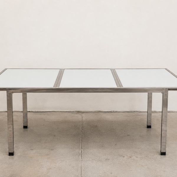 Design Institute of America Chrome Expandable Dining Table. Mirrored Glass Inserts. Attributed to Milo Baughman. Delivery Priced Separately.