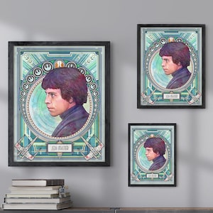 May include: Three framed art prints featuring a portrait of a man with the text "Han Solo" on the bottom of each print. The prints are hanging on a light grey wall above a metal cabinet with two doors.
