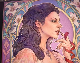 May include: A digital illustration featuring a person with long, wavy dark purple hair in profile, wearing a light pink garment and a detailed pendant necklace. The background includes a circular frame, pink lilies, and a small bird.