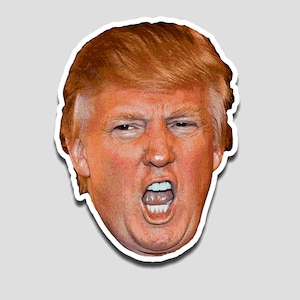 May include: A sticker featuring a close-up of a man's face with an open mouth, showing teeth. The man has orange-blonde hair and a white border. The sticker is on a gray background.