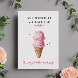 May include: A greeting card with the text "Some things in life are just better doubled!" and "Happy Mother's Day". The card features a pink ice cream cone with sprinkles and a rainbow base, with small pink hearts.