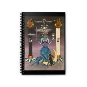 May include: Spiral-bound notebook with a tarot card illustration. The artwork features a blue figure holding a sword and chalice, flanked by pillars and a crescent moon. A black rabbit sits below the figure.