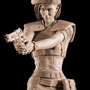 May include: A sepia-toned figurine of a woman in tactical gear, holding a handgun. She wears a beret with a badge, a ribbed top, and a utility belt. The figure has a determined expression, suggesting a military or action theme.